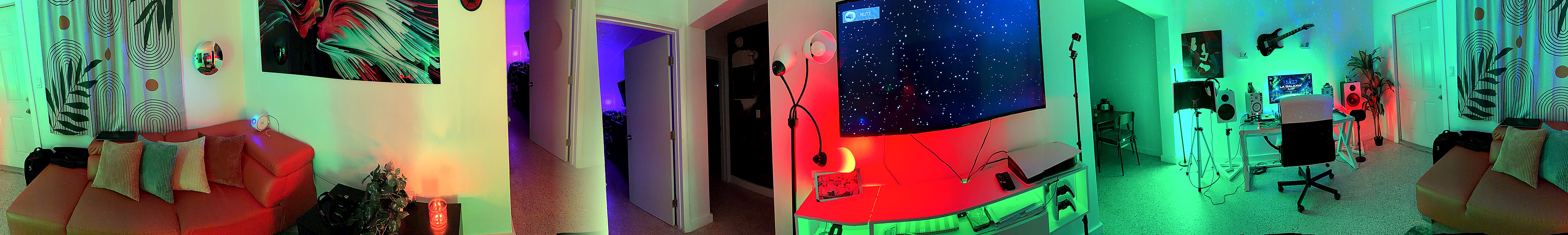 Merged panoramic 360-style view of La Galaxia home studio with artist lounge, colorful lights, TV visuals, vocal production desk, speakers, and recording setup